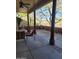 Covered patio featuring outdoor seating with views at 55823 N 329Th Dr, Wickenburg, AZ 85390