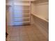 Spacious walk-in closet with built-in shelving for ample storage at 55823 N 329Th Dr, Wickenburg, AZ 85390