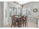 Bright dining area with wood table and four chairs at 5613 N Laguna Ct, Litchfield Park, AZ 85340