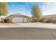 Spacious driveway and beautifully landscaped yard at 5613 N Laguna Ct, Litchfield Park, AZ 85340