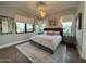 Bright bedroom with king-size bed and wood flooring at 6922 E Cactus Wren Rd, Paradise Valley, AZ 85253