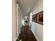 Light-filled hallway with wood floors and barn door at 6922 E Cactus Wren Rd, Paradise Valley, AZ 85253