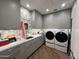 Modern laundry room with washer, dryer, and ample counter space at 6922 E Cactus Wren Rd, Paradise Valley, AZ 85253