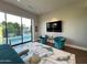 Main bedroom with pool view and sitting area at 6922 E Cactus Wren Rd, Paradise Valley, AZ 85253