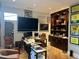 Home office with built-in shelving, large desk, and golf memorabilia at 6922 E Cactus Wren Rd, Paradise Valley, AZ 85253