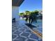 Inviting pool area with geometric tile and lush landscaping at 6922 E Cactus Wren Rd, Paradise Valley, AZ 85253