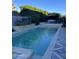 Stunning pool with spacious deck and surrounding landscaping at 6922 E Cactus Wren Rd, Paradise Valley, AZ 85253