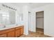 Bathroom boasts double sinks, a large mirror, and a linen closet at 7411 W Alta Vista Rd, Laveen, AZ 85339