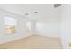 Well-lit bedroom featuring wood flooring and window blinds at 7411 W Alta Vista Rd, Laveen, AZ 85339