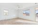 Bedroom with tile flooring, ceiling fan, and sliding glass door at 7411 W Alta Vista Rd, Laveen, AZ 85339