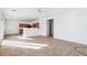 Dining area with tile flooring, kitchen access, and sliding glass door at 7411 W Alta Vista Rd, Laveen, AZ 85339