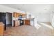 Kitchen with wooden cabinets, tile floor, and stainless steel appliances at 7411 W Alta Vista Rd, Laveen, AZ 85339