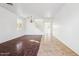 Living room with tile and hardwood flooring, and a staircase at 7411 W Alta Vista Rd, Laveen, AZ 85339