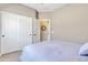 Bright bedroom with double doors and ensuite bathroom at 789 E Blossom Rd, San Tan Valley, AZ 85143