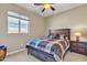 Bedroom with wood-toned furniture and large window at 789 E Blossom Rd, San Tan Valley, AZ 85143