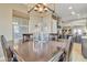 Bright dining room features a spacious table and modern chandelier at 789 E Blossom Rd, San Tan Valley, AZ 85143