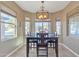 Bright dining room with large windows and a chandelier at 789 E Blossom Rd, San Tan Valley, AZ 85143