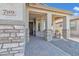 Covered entryway with stone accents and a seating area at 789 E Blossom Rd, San Tan Valley, AZ 85143