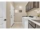 Laundry room with cabinets and exterior access at 789 E Blossom Rd, San Tan Valley, AZ 85143