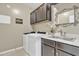 Laundry room with washer, dryer, and cabinets at 789 E Blossom Rd, San Tan Valley, AZ 85143