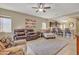 Open living room with leather seating and view to kitchen at 789 E Blossom Rd, San Tan Valley, AZ 85143