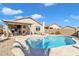 Stunning kidney shaped pool with patio and covered seating at 789 E Blossom Rd, San Tan Valley, AZ 85143