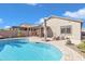 Large kidney shaped pool with patio and covered seating at 789 E Blossom Rd, San Tan Valley, AZ 85143