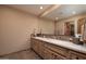 Double vanity bathroom with granite countertop at 8502 E Country Club Trl, Scottsdale, AZ 85255