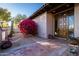 Elegant entryway with a large wooden door and vibrant bougainvillea at 8502 E Country Club Trl, Scottsdale, AZ 85255