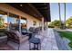 Covered patio with seating area, offering shade and comfort at 8502 E Country Club Trl, Scottsdale, AZ 85255