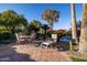 Outdoor patio with hexagonal tile, comfortable seating, and a view of the pool at 8502 E Country Club Trl, Scottsdale, AZ 85255