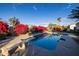 Relaxing pool area with a diving board and plenty of space for sunbathing at 8502 E Country Club Trl, Scottsdale, AZ 85255