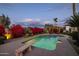 Inviting swimming pool with diving board, surrounded by lush landscaping at 8502 E Country Club Trl, Scottsdale, AZ 85255