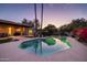 Stunning kidney-shaped pool with a tranquil ambiance at 8502 E Country Club Trl, Scottsdale, AZ 85255