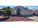 Front view of a single-story house with a two-car garage at 9215 W Sandra Ter, Peoria, AZ 85382