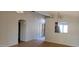 Living room with vaulted ceiling, wood flooring and a view into the kitchen at 9215 W Sandra Ter, Peoria, AZ 85382