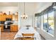 Kitchen dining area with table and chairs, overlooking backyard at 937 N Kingston St, Gilbert, AZ 85233