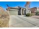 Single story home with a two-car garage and neatly landscaped yard at 937 N Kingston St, Gilbert, AZ 85233