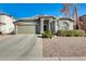 Single story home with a two-car garage and neatly landscaped yard at 937 N Kingston St, Gilbert, AZ 85233