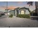 Single-story home with a two-car garage and desert landscaping at 937 N Kingston St, Gilbert, AZ 85233