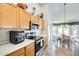 Kitchen features stainless steel appliances and wood cabinetry at 937 N Kingston St, Gilbert, AZ 85233