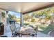 Covered patio with table and chairs, overlooking backyard at 937 N Kingston St, Gilbert, AZ 85233