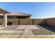 Backyard patio and grass area with grill at 9519 W Trumbull Rd, Tolleson, AZ 85353