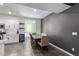 Casual dining area with wood table and chairs, adjacent to the kitchen at 9519 W Trumbull Rd, Tolleson, AZ 85353