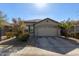 One-story house with a two-car garage and well-maintained landscaping at 9519 W Trumbull Rd, Tolleson, AZ 85353