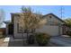 Single story home with light tan exterior and attached garage at 9519 W Trumbull Rd, Tolleson, AZ 85353