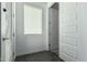 Clean and bright hallway with neutral colored walls and tiled flooring at 9519 W Trumbull Rd, Tolleson, AZ 85353