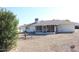 Backyard with gravel and a screened patio at 9714 W Edward Dr, Sun City, AZ 85351