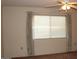 Bedroom with window, blinds, and curtains at 9714 W Edward Dr, Sun City, AZ 85351