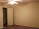 Spacious bedroom with closet and ceiling fan at 9714 W Edward Dr, Sun City, AZ 85351